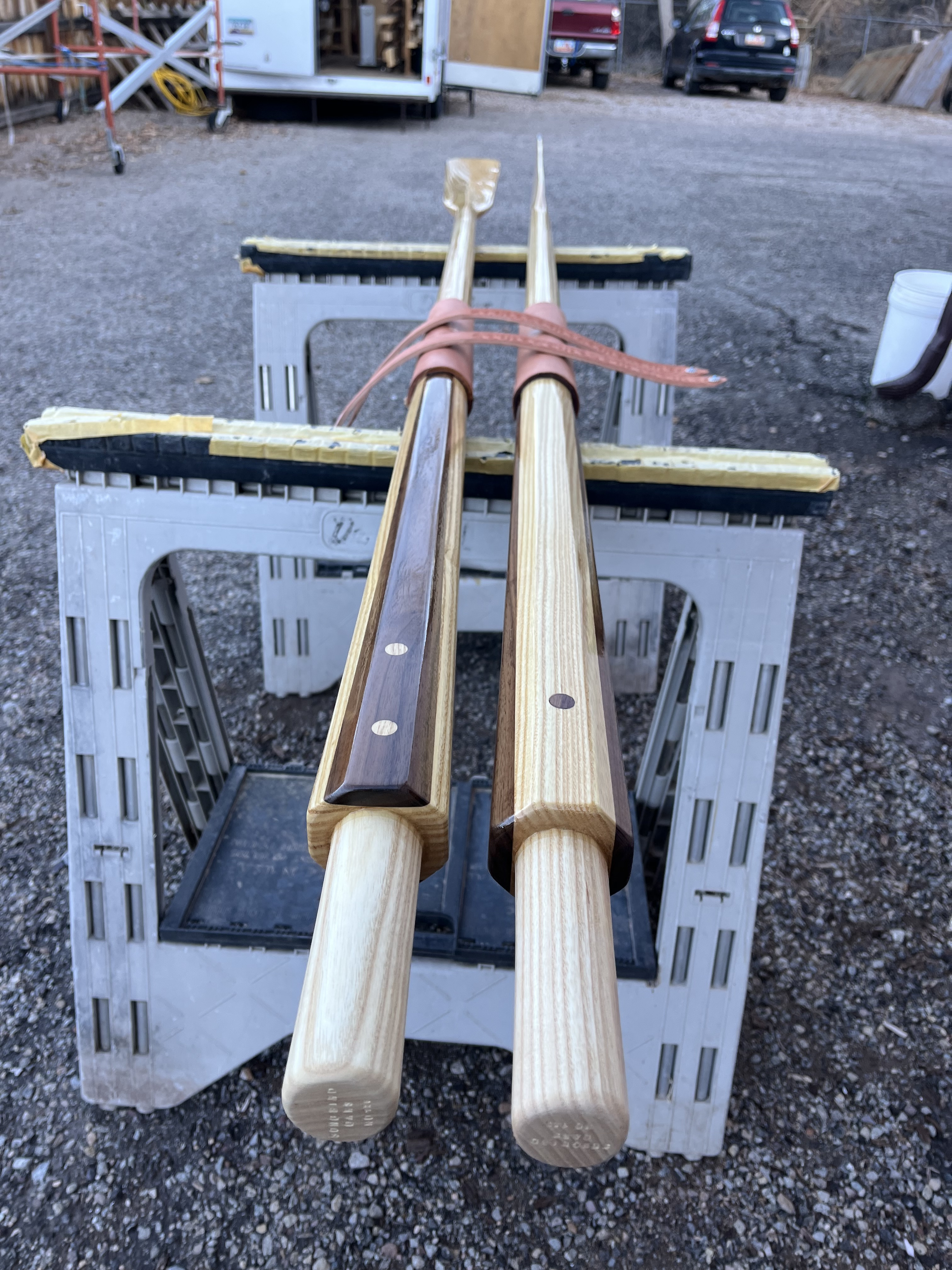 Walnut and ash dots decorate the inboard looms of the wood oars.
